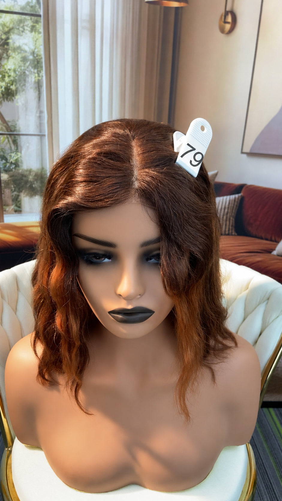 Luvme Hair live outlet wig displayed on a mannequin head, showcasing a styled synthetic wig with natural hair texture.