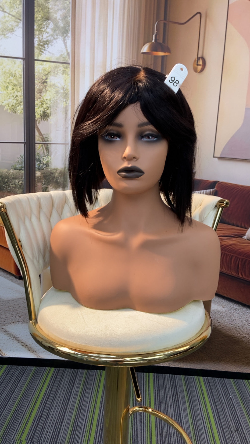 Luvme Hair live outlet wig displayed in natural black, styled with soft waves, showcasing the hair's volume and shine.