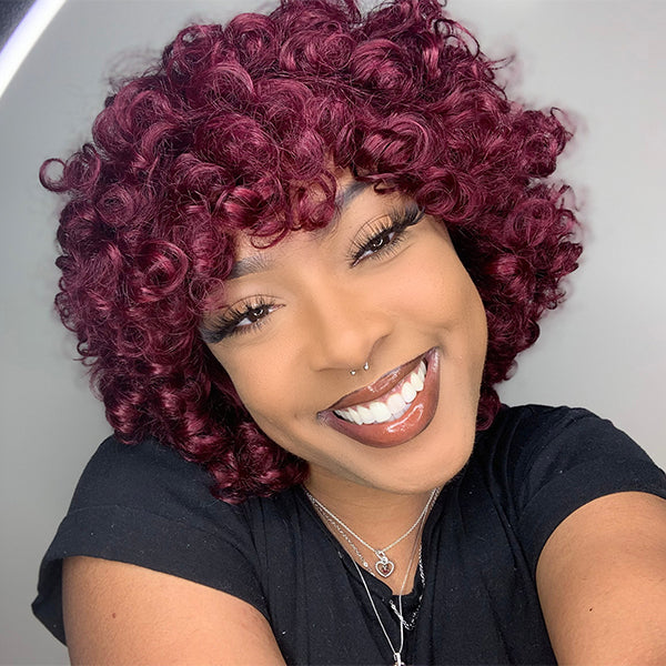 Luvme burgundy fluffy rose curl short wig with bangs, 100% human hair, styled with voluminous curls and a natural finish.