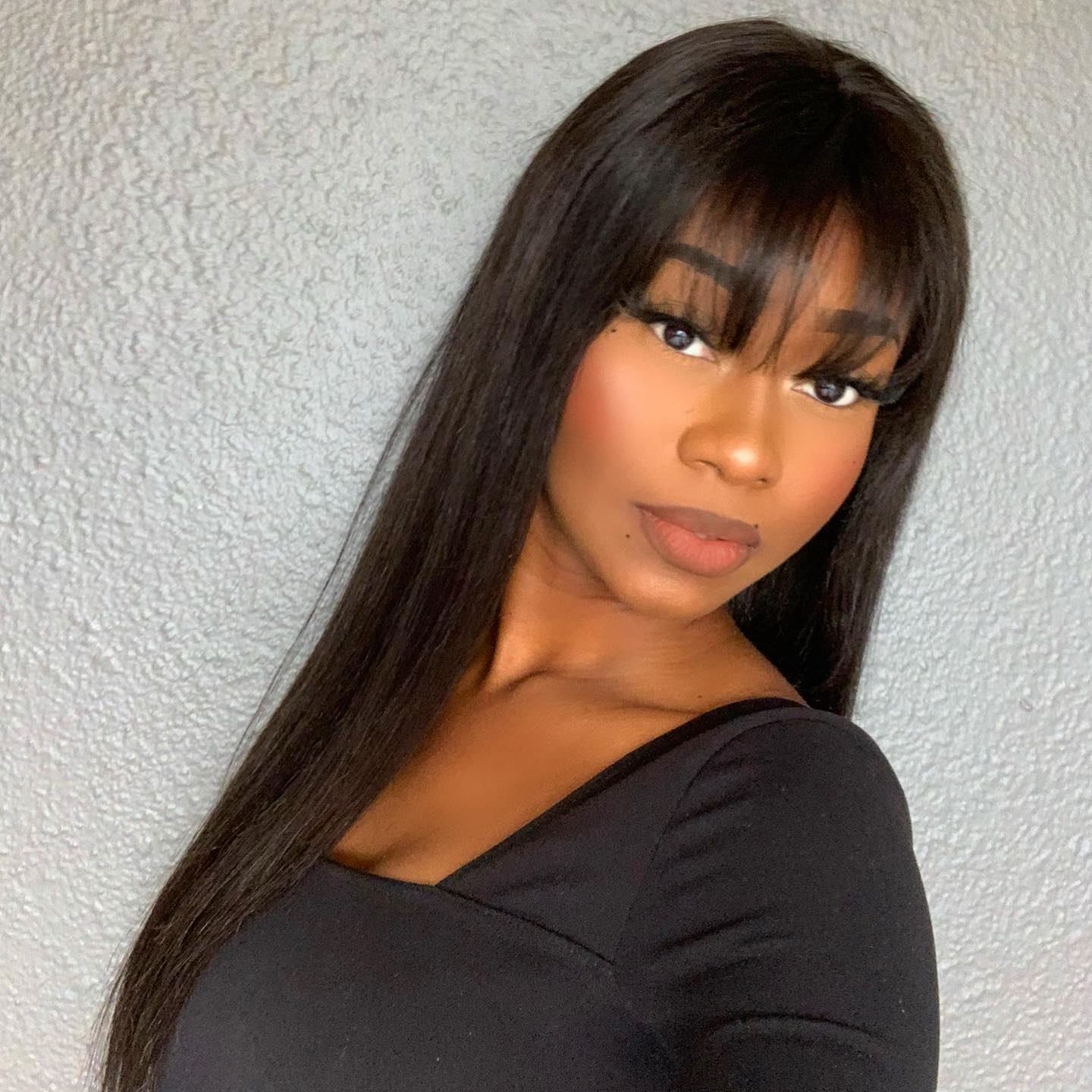 Luvme Throw On & Go Natural Black Straight No Lace Glueless Long Wig with Bangs, featuring a sleek, straight style and natural black color.